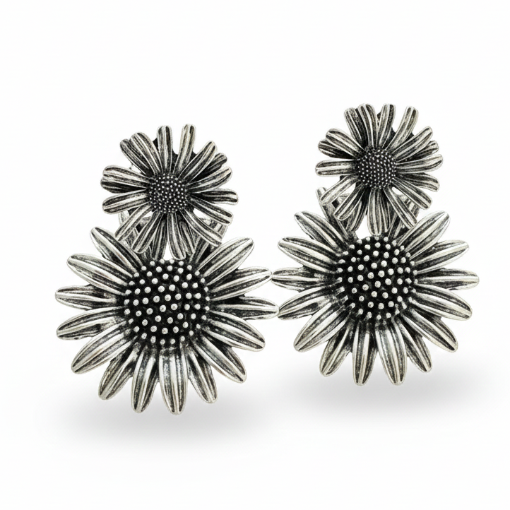 Modern metal earrings with mismatched flower shapes, one small and one large_still