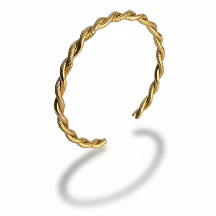 Statement bracelet featuring a bold twisted gold design