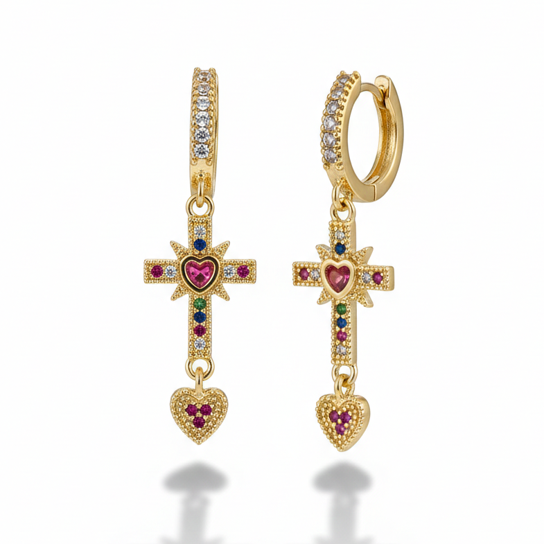 Tiny gold hoop earrings with dangling rhinestone cross charm_still