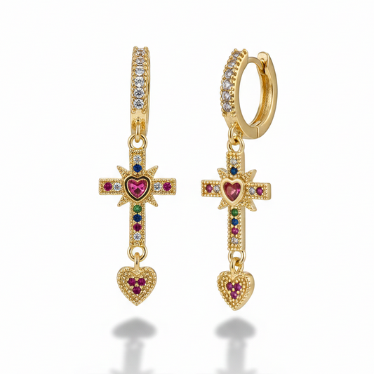 Tiny gold hoop earrings with dangling rhinestone cross charm_still