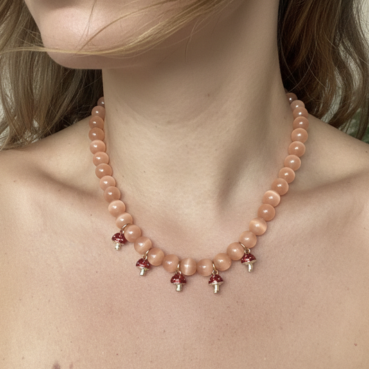Statement orange beaded necklace with cute mushroom pendants_close up