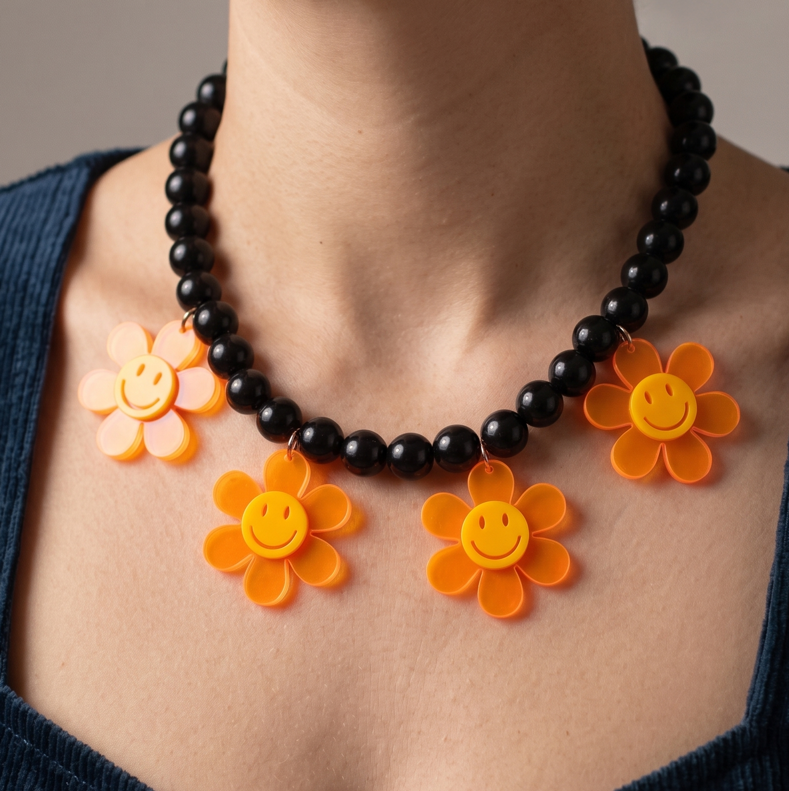 Statement necklace with black beads and neon flower pendants, handmade jewellery