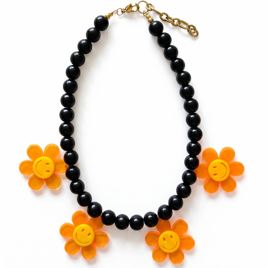 Statement necklace with black beads and neon flower pendants, handmade jewellery