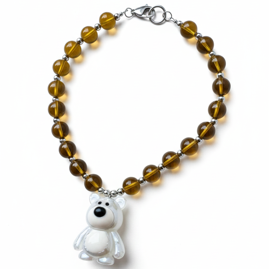 Colorful beaded necklace featuring a statement teddy bear pendant_still
