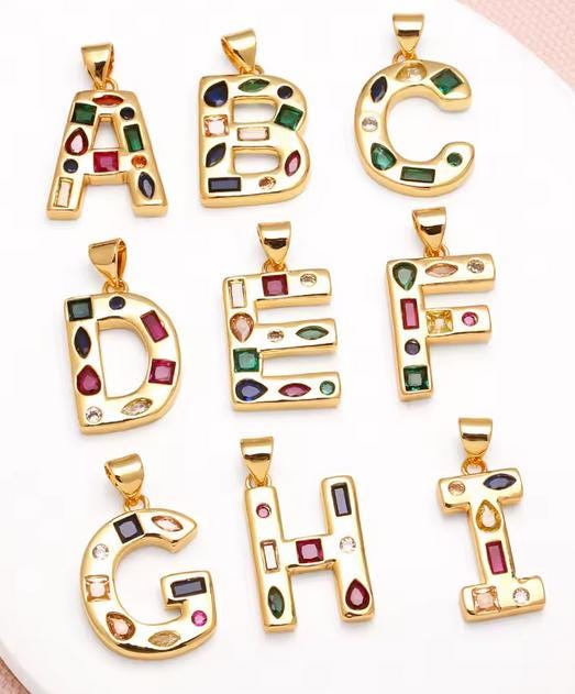 Necklace made with colorful beads and a personalized initial pendant_letters