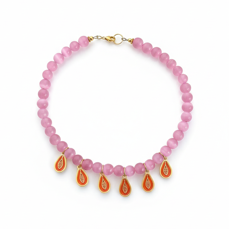 Statement pink beaded necklace featuring playful papaya pendants, perfect for a fun look_still