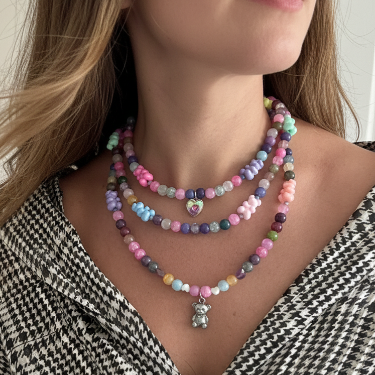 Layered three-strand necklace with colorful beads and fun bear pendants, handmade and statement-making.