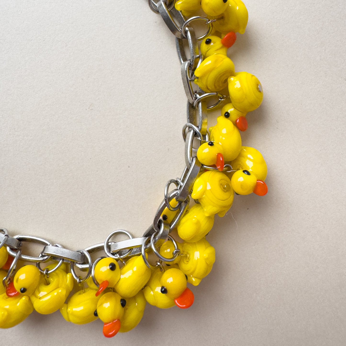 bold silver chain necklace with glass duck pendants, fun statement necklace