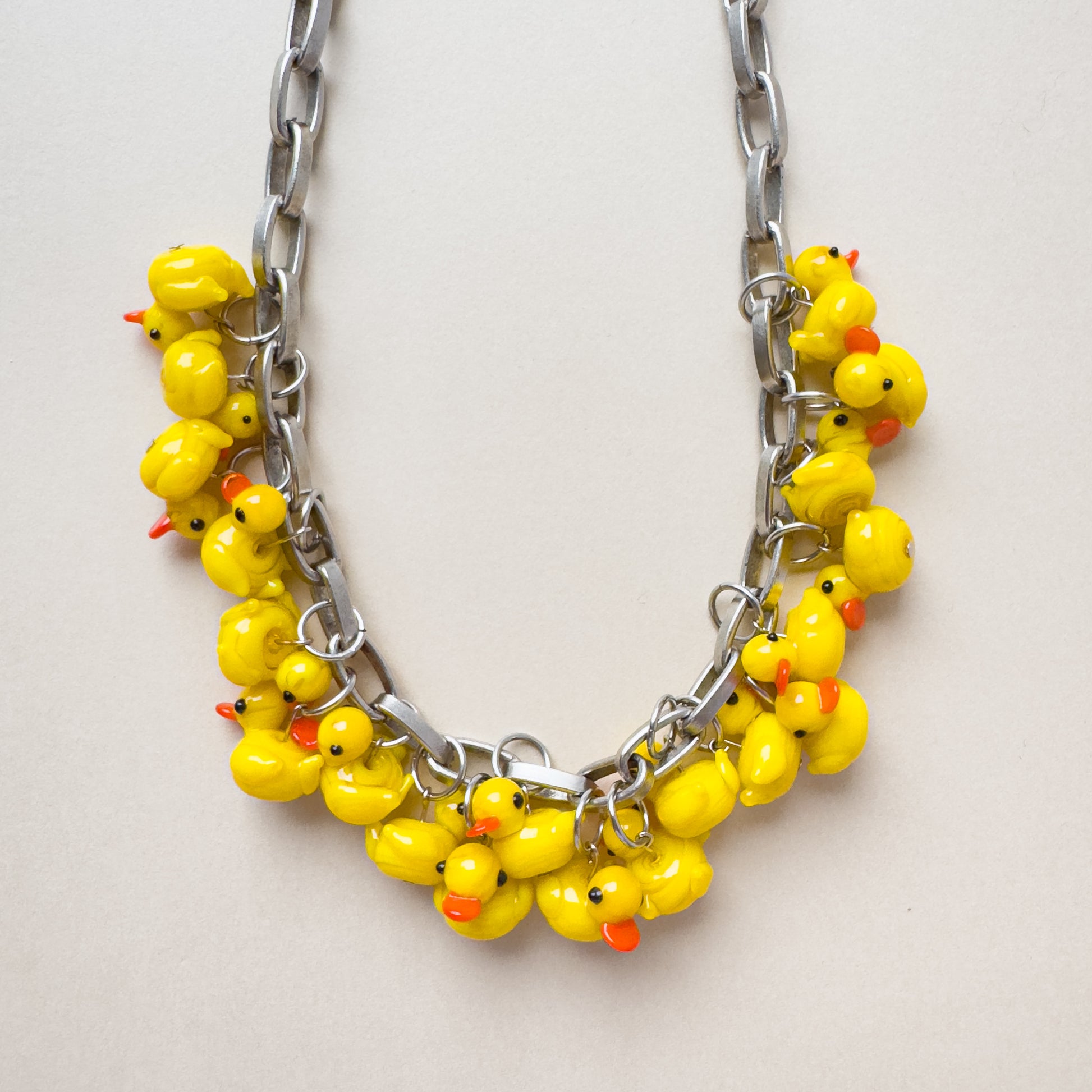bold silver chain necklace with glass duck pendants, fun statement necklace